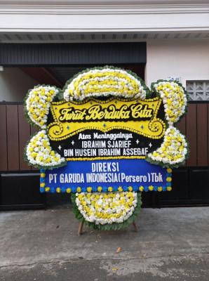 Papan Bunga Duka di Benda