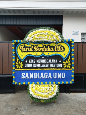 Papan Bunga Duka di Benda
